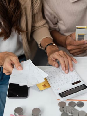 a couple budgeting together and managing their finances while calculating the cost of full time rv living